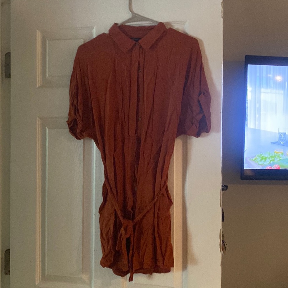 Burnt orange colored dress. Also this is a mid dress in a large.